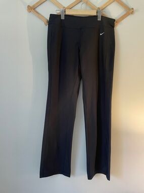 Nike women’s Black Boot-Cut Athletic Pants with White Swoosh size L